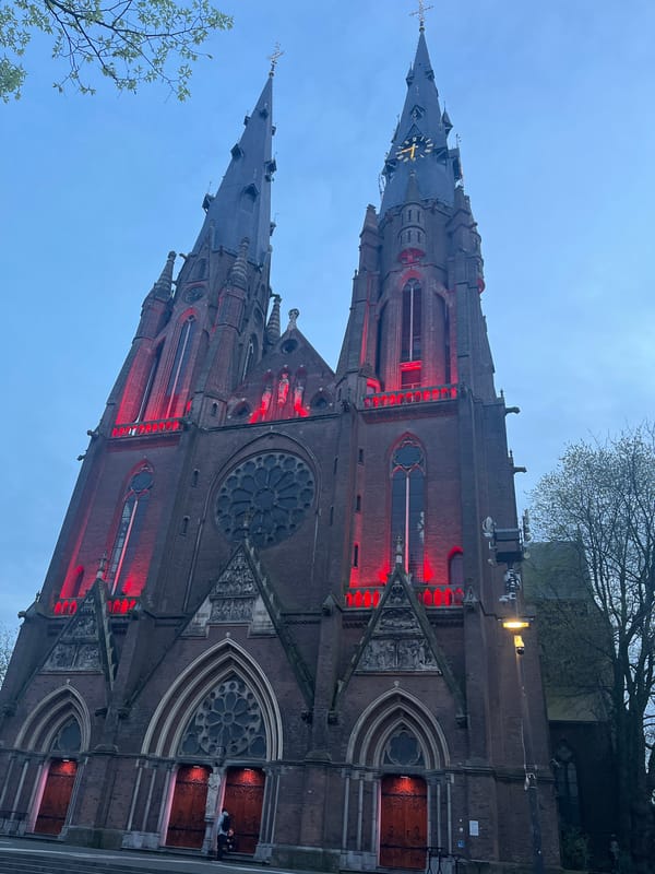 Gothic church illuminated red in Eindhoven evening