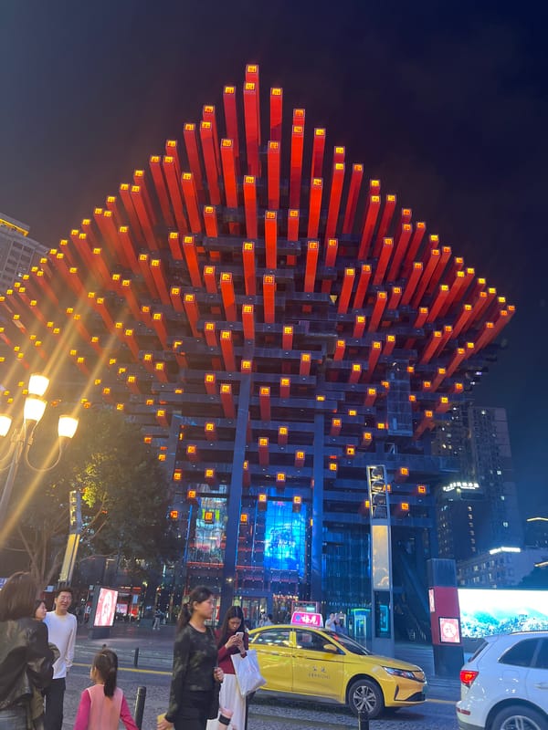 Crowds gather near Raffles City Chongqing complex in Yuzhong District