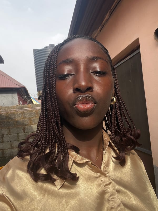 Woman photographed in gold attire in Abuja morning session