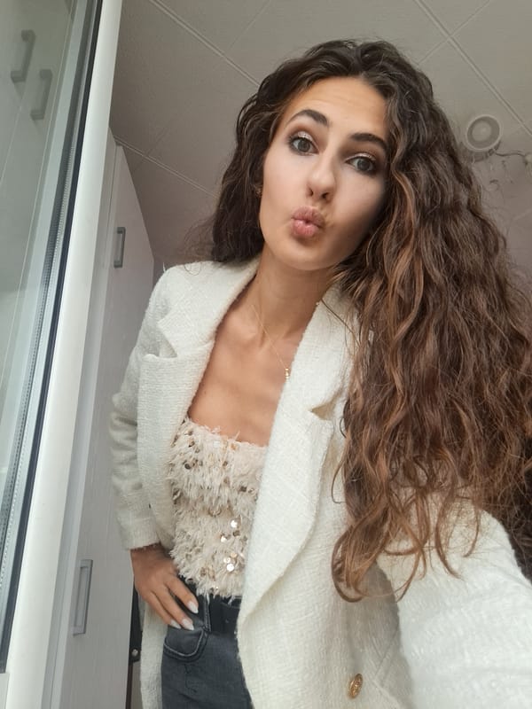 Woman takes selfies in white sequined outfits, Negovan Bulgaria