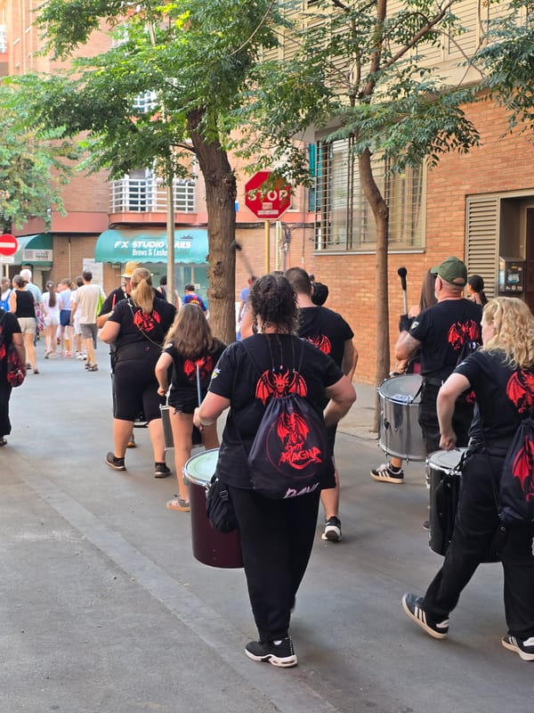 Dragon float, drummers, and stick dancers fill Cornellà streets
