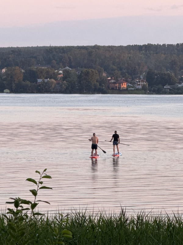 Paddleboarding on a quiet lake in Votkinsk at dusk
