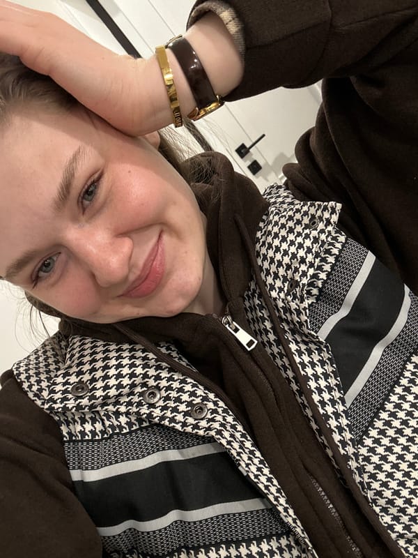 Woman records selfie videos with flower in Kazan apartment