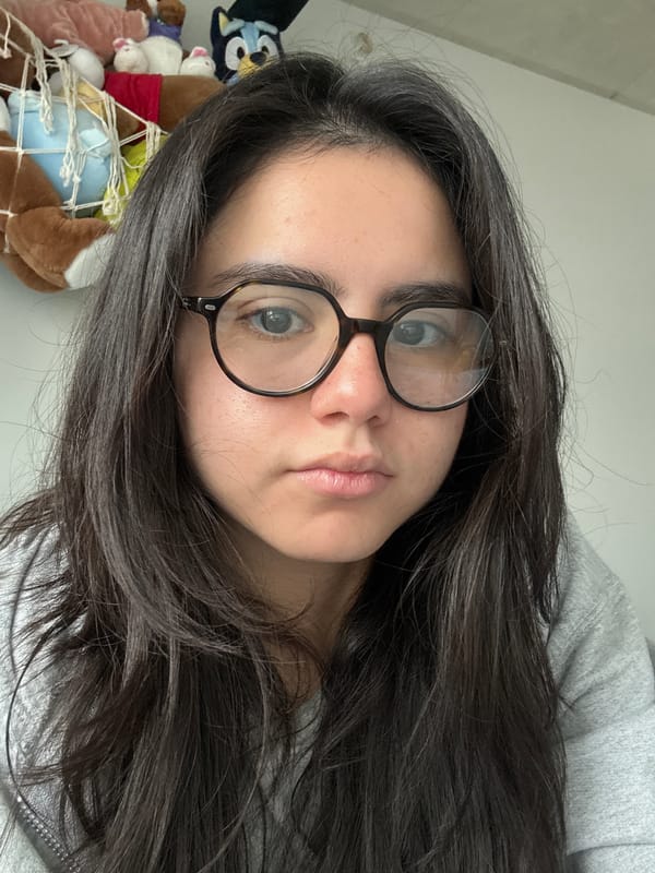 Woman takes selfies with UT Tower view in Austin