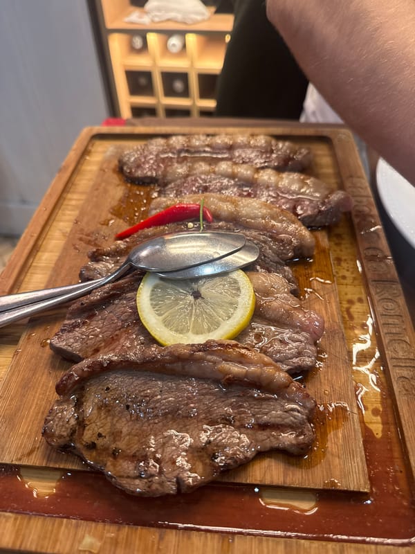 Diner enjoys traditional Portuguese beef at Coimbra restaurant