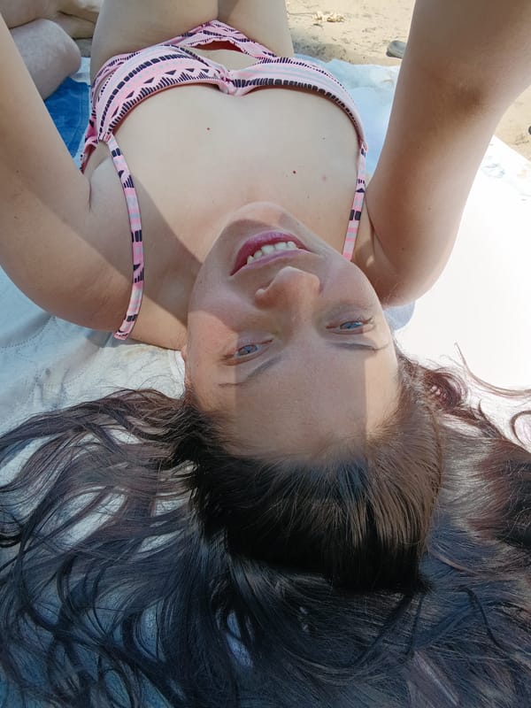 Beach sunbathing and water activities documented by witnesses