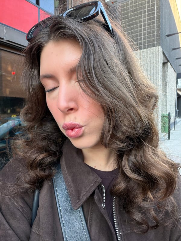 Woman poses for playful portrait in downtown Montreal