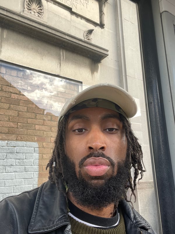 Portrait captured of man in camouflage cap, London