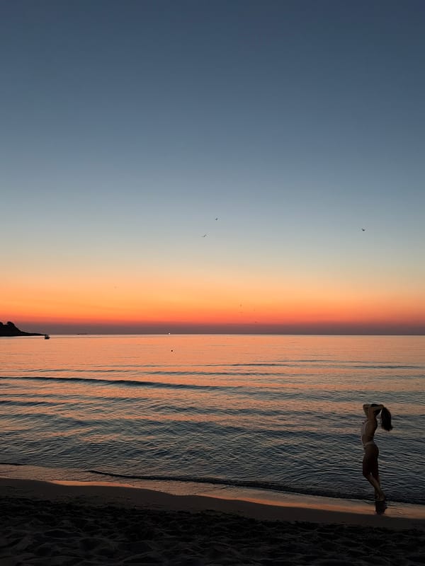 Sunset beach scene with a brief detour into a club