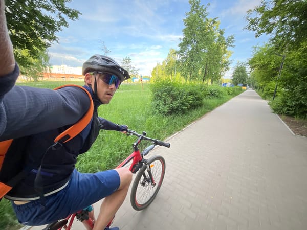 Cyclist tours landmarks in Chaikovsky, Russia during morning ride