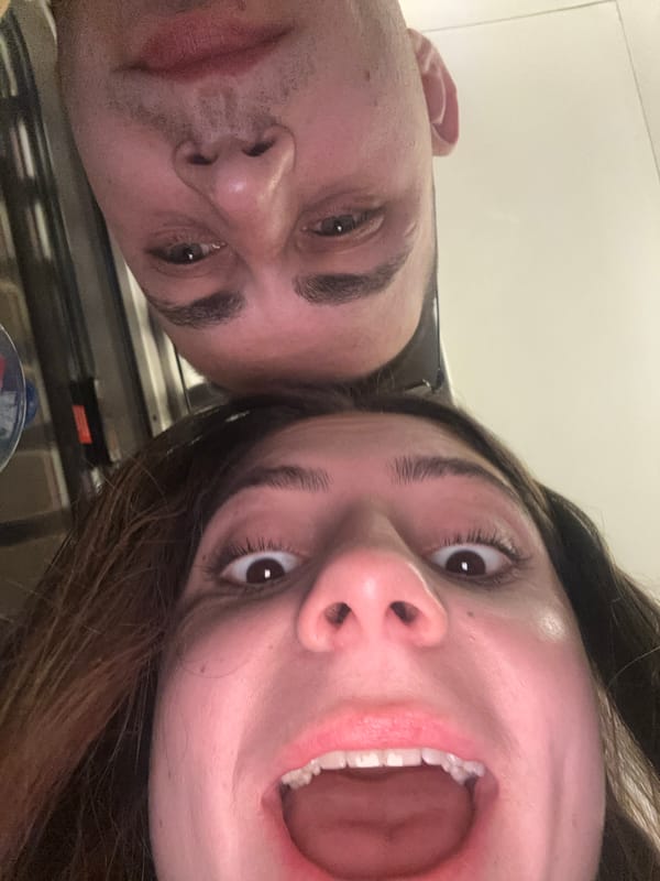 Couple takes selfies together in brief photo session