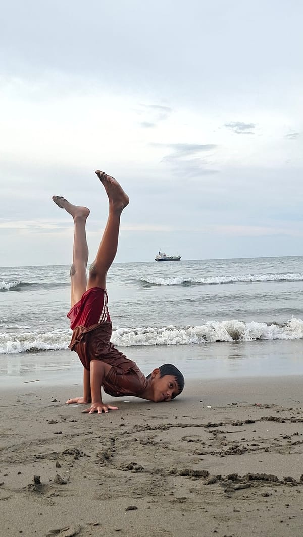 Kids playing, fishing, and swimming at a Lhokseumawe beach