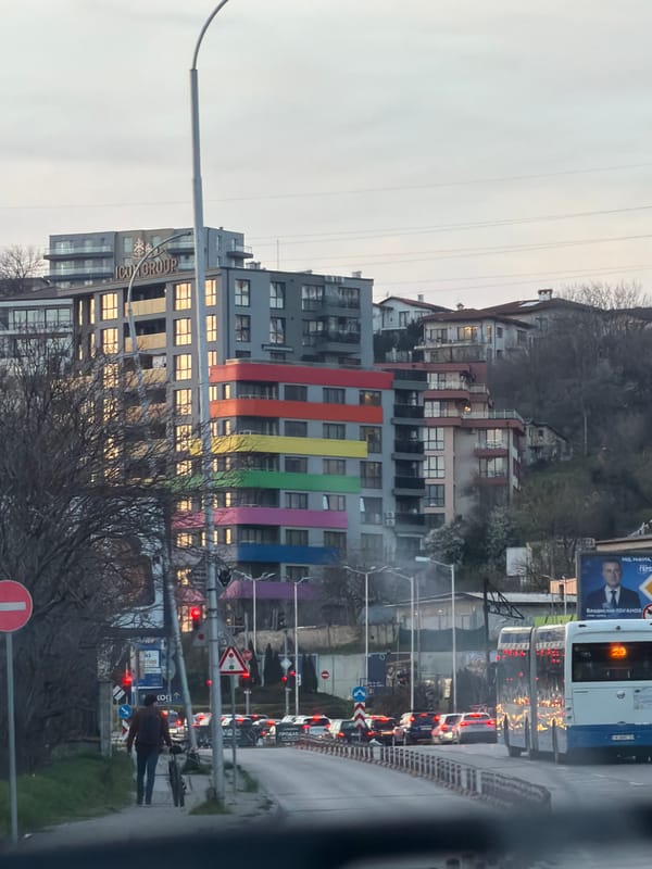 Rainbow-striped building observed in Varna, Bulgaria street scene
