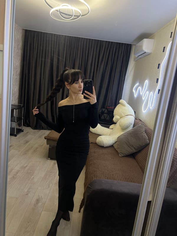 Woman takes mirror selfies in black dress, Votkinsk