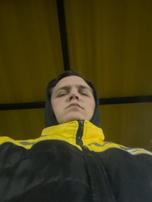 Person in yellow jacket photographed in Lupanovo, Russia