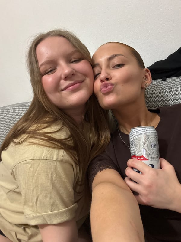 Women share fried chicken and beer at casual gathering
