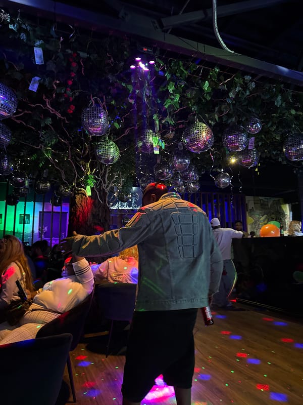 Man dances at disco club in Bobrovo, Russia