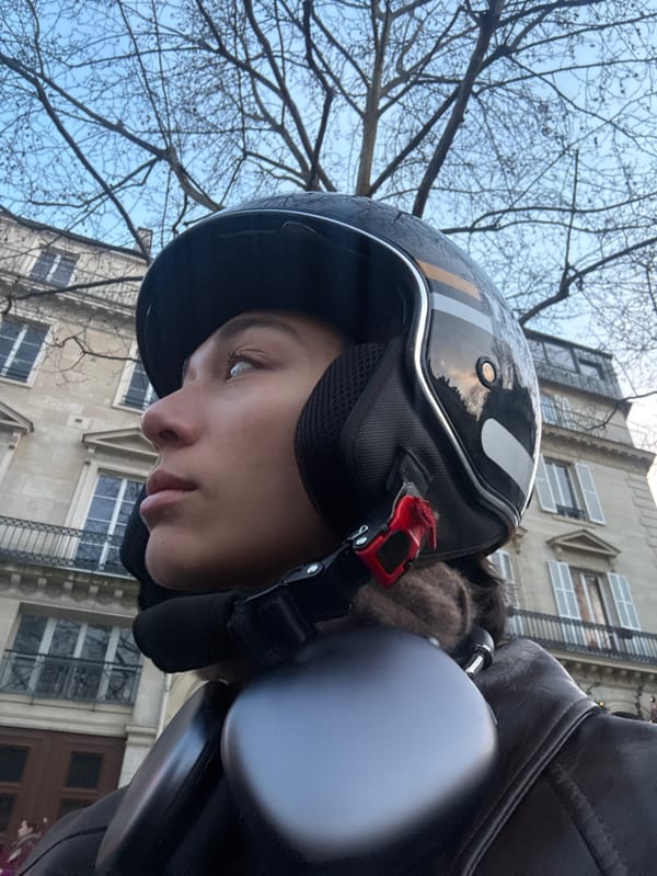 Motorcyclist photographed touring central Paris landmarks during afternoon ride