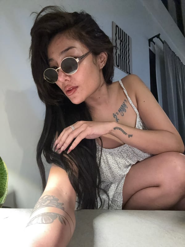 Woman in sunglasses photographed in multiple indoor poses