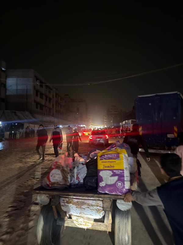 Night street activity in Gaza shows supply delivery, balloon vendor