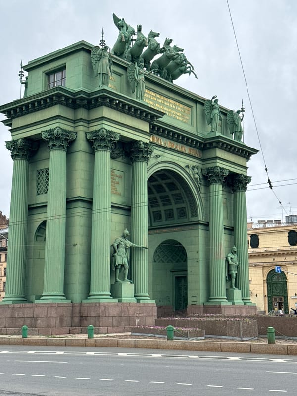 Soviet monuments, imperial arches, and a collectible figurine in St. Petersburg