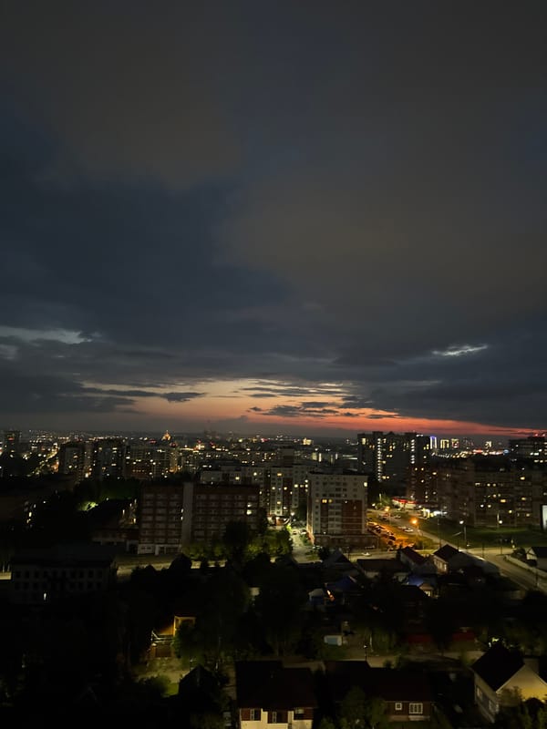 Evening moments in Izhevsk: sunset skies, trams, and puppy