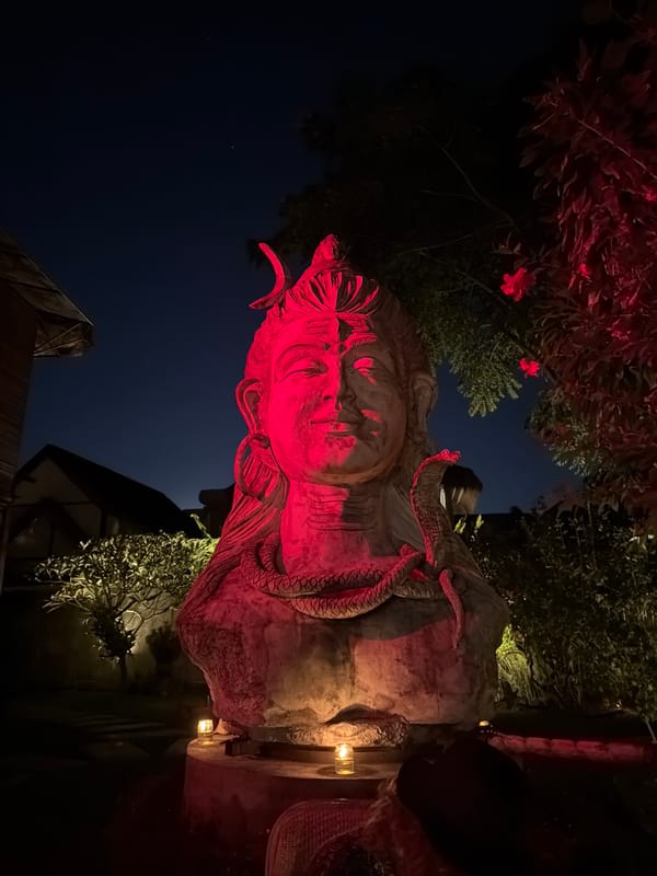 Bali evening: beach sunsets, a Shiva statue, and Kuta streets