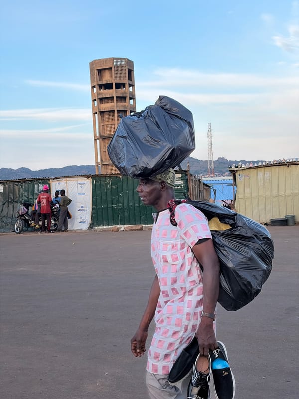 Everyday life across Jos streets and salons, mid-afternoon.