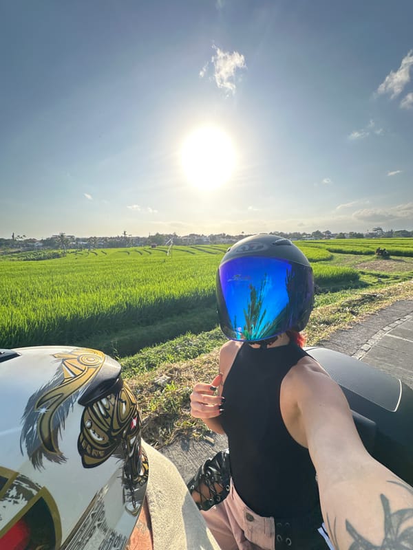 Morning motorcycle moments near Bali rice paddies