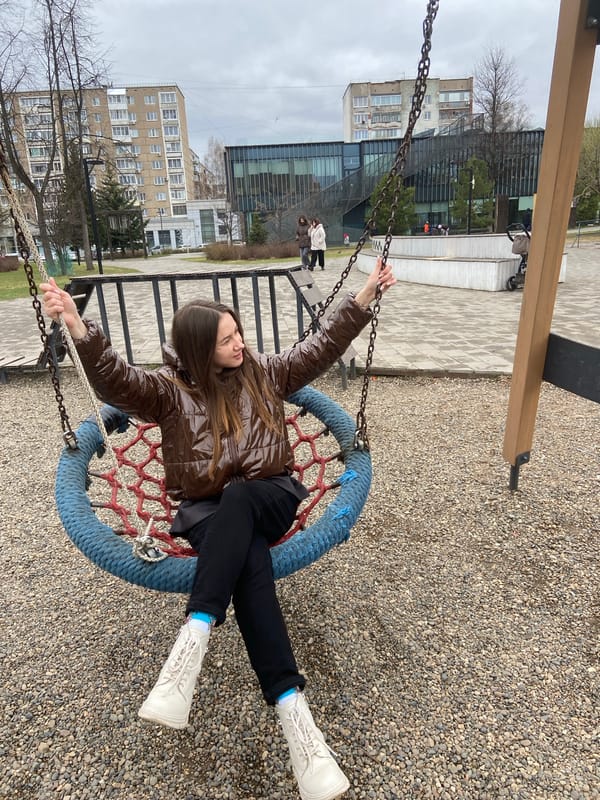 Woman enjoys morning swing time at Izhevsk playground