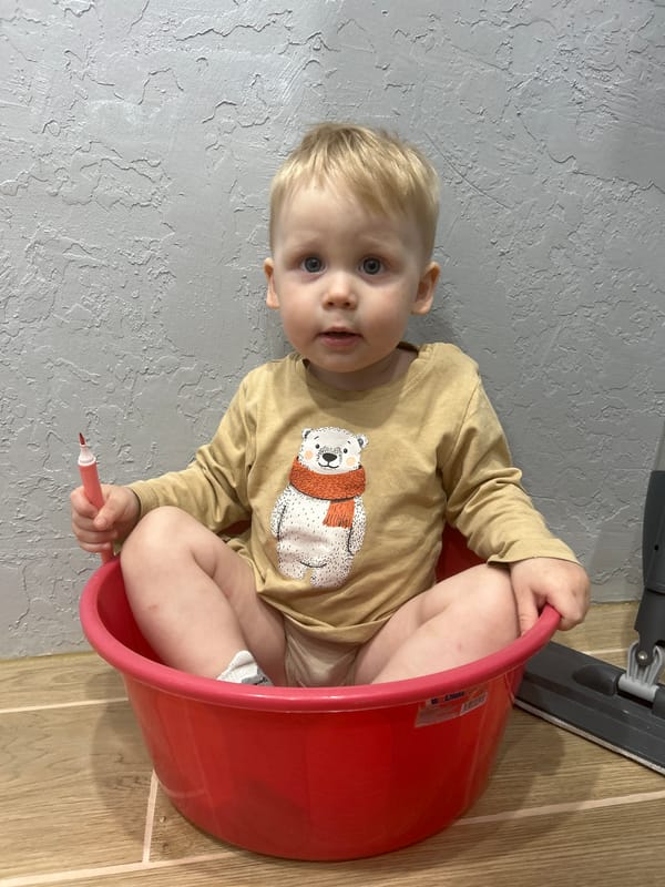 Child at play with toys in Chaikovsky, Russia