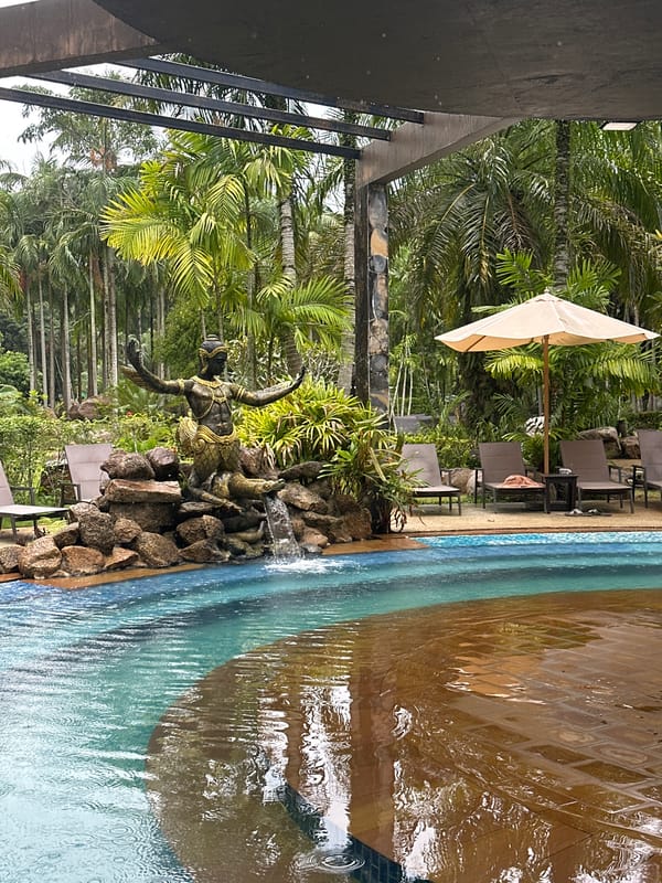 Rainy morning at a tropical resort pool