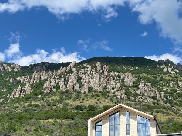 Rugged mountain landscape with construction site and scenic stop