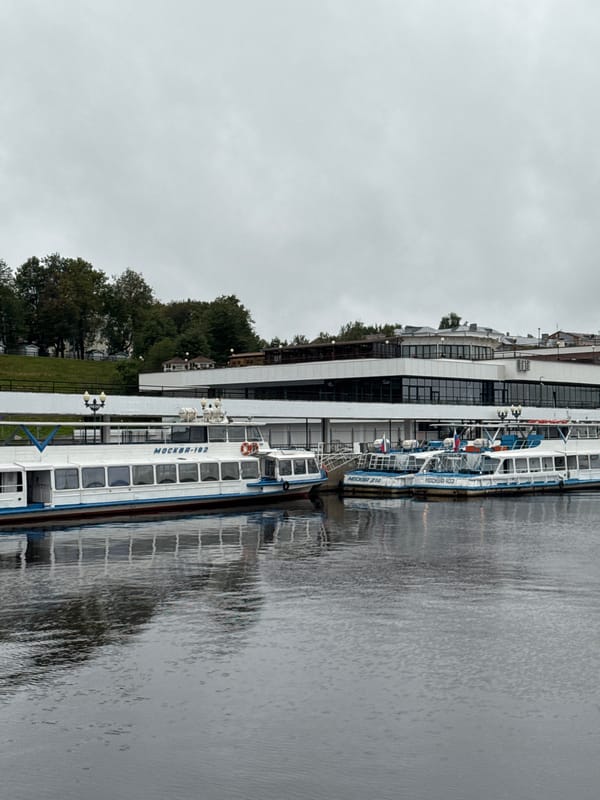 Overcast evening along Shebunino's riverfront, golden domes in view