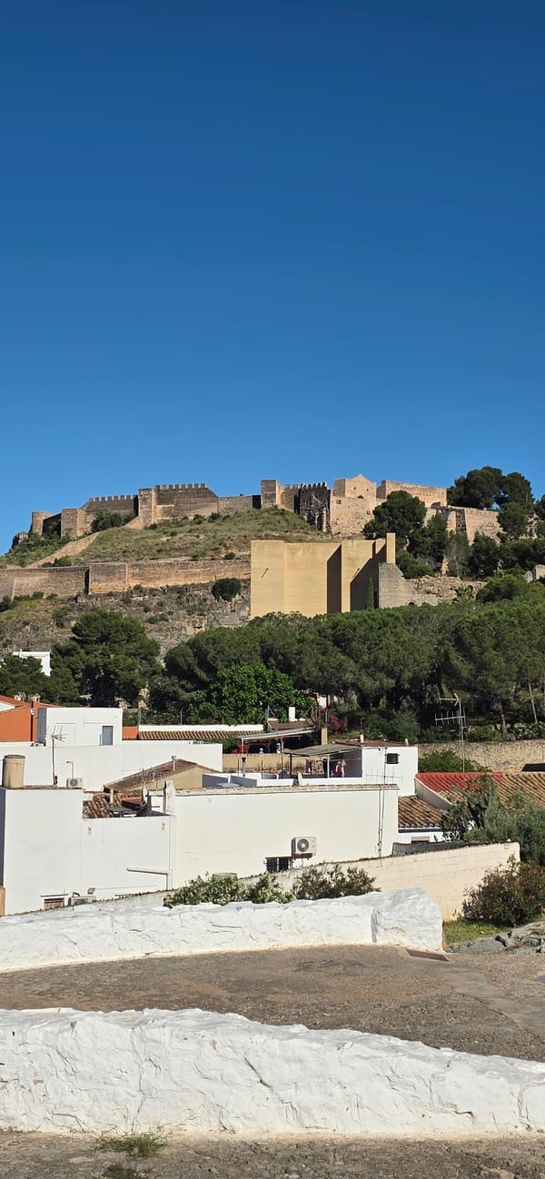 Tourist explores historic Sagunto castle and ruins in Spain