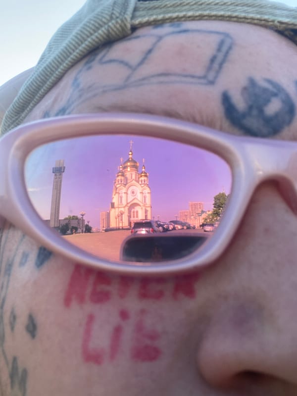 Glass cube and pink shades reflect Khabarovsk's Transfiguration Cathedral