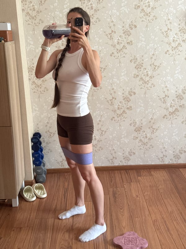 Resistance band workout documented in a Riga apartment