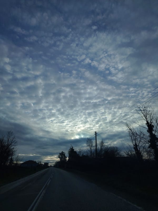 Rural road captured under cloudy skies in Moravitsa, Bulgaria