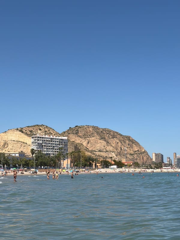 Beachgoers enjoy afternoon activities at Alicante's Playa del Postiguet