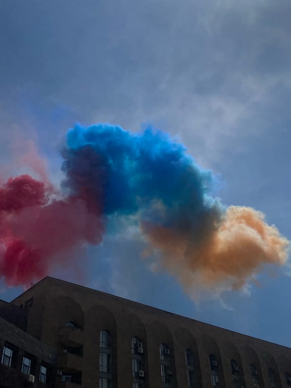 Marching band draws crowds amid colored smoke in Yerevan plaza