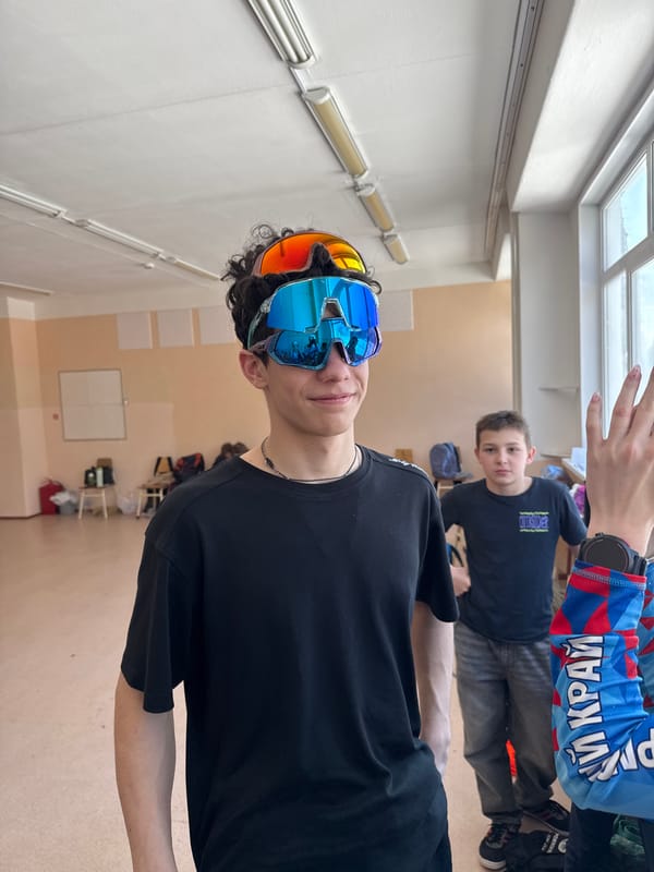 Three people photographed in distinctive attire in Usolye, Russia