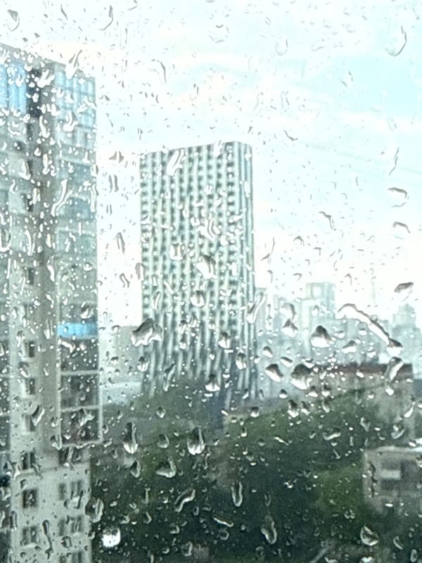 Rainy day captured through window in Yekaterinburg cityscape