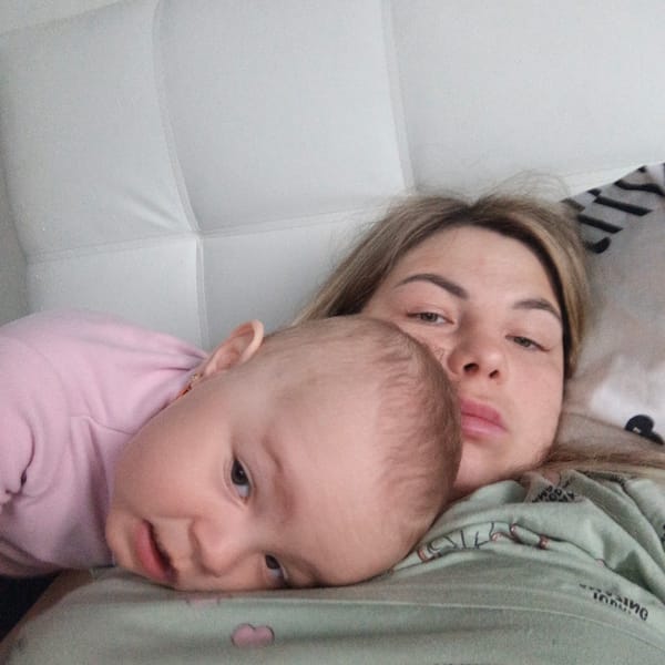 Mother and baby share quiet bonding moments in bedroom