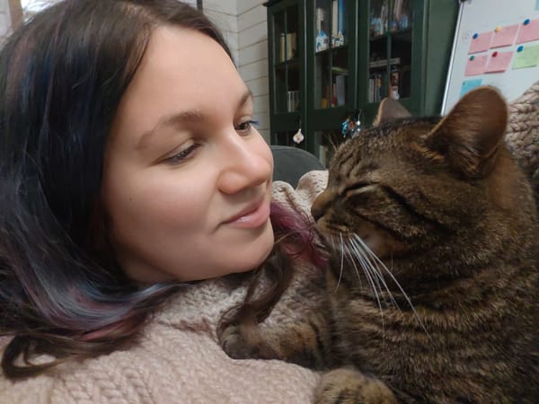 Woman documents cozy afternoon with tabby cat in Russia