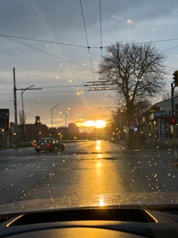 Rainy street view through car window in Sofia