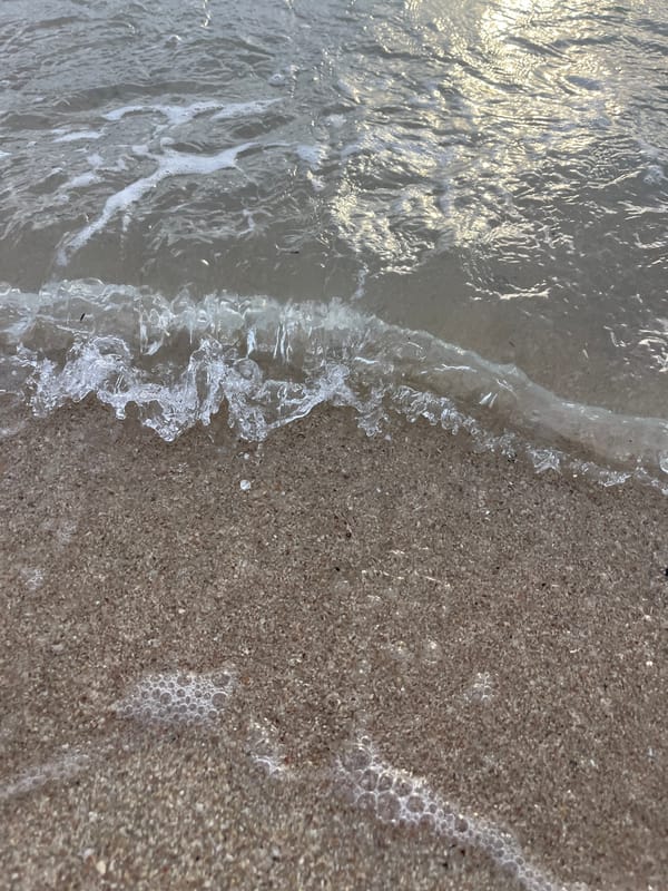 Lazy morning on Ko Samui's beach — yoga, kayaking, and shoreline light