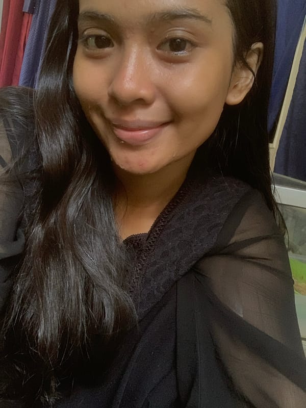 Woman takes morning selfies while reclining in Sungai Meriam