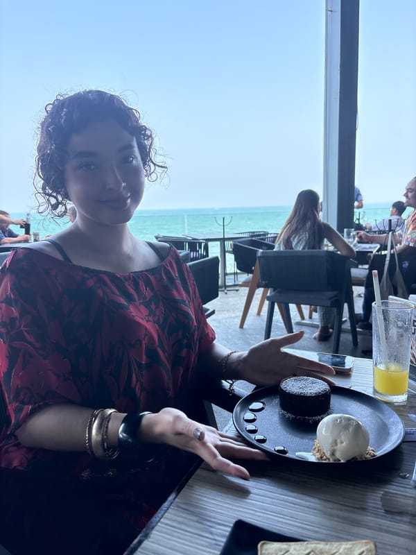 Woman enjoys chocolate dessert at Veracruz oceanfront restaurant