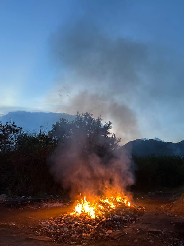 Roadside debris fire burns in Bac Nha Trang Ward