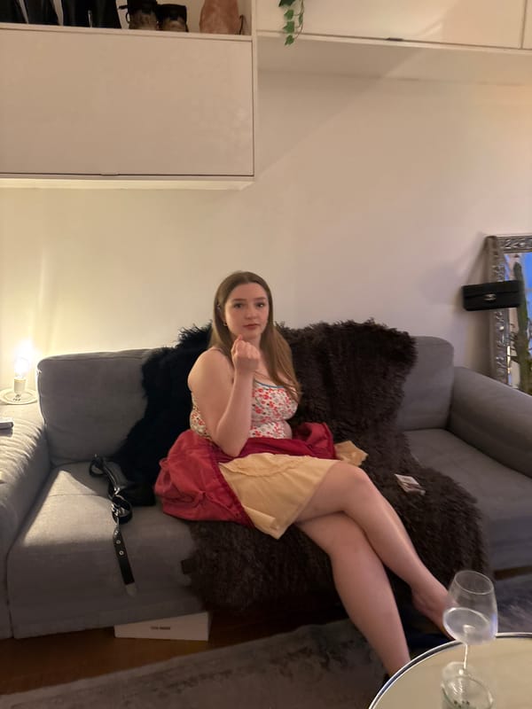 Woman relaxes in London living room during evening hours